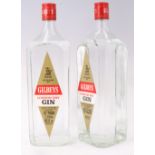 Two bottles of 1970s Gilbey's London Dry Gin, 1.1 litres each