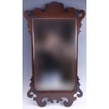 A 1930s walnut Chippendale influenced fretwork mirror, 90 x 50 cm