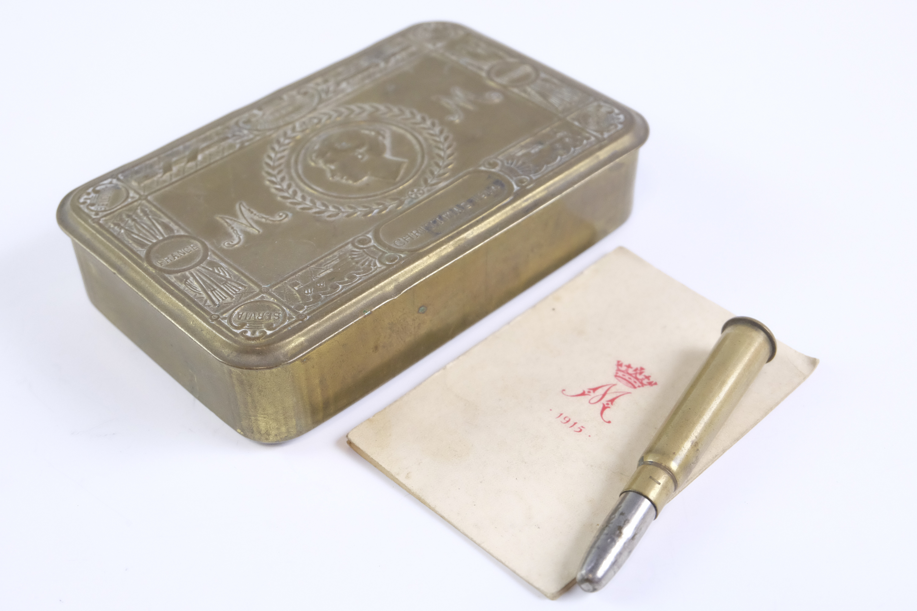 A Great War Princess Mary 1914 gift tin with New Year greetings card and bullet pencil