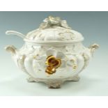 A large early 20th Century Capodimonte tureen, bearing moulded floral gilt decoration, 40 cm