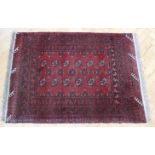 An Afghan Bokhara wool-pile rug, 140 x 100 cm