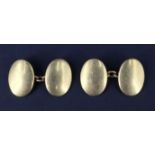 A pair of late 19th / early 20th Century 18 ct yellow metal cufflinks, having convex oval faces,