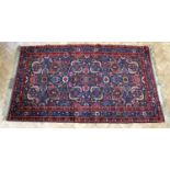 A Persian Josheghan hand-knotted rug, 230 x 131 cm