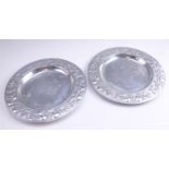 A pair of late 20th Century cast aluminium chargers by Arthur Court, having fruit decorated rims,