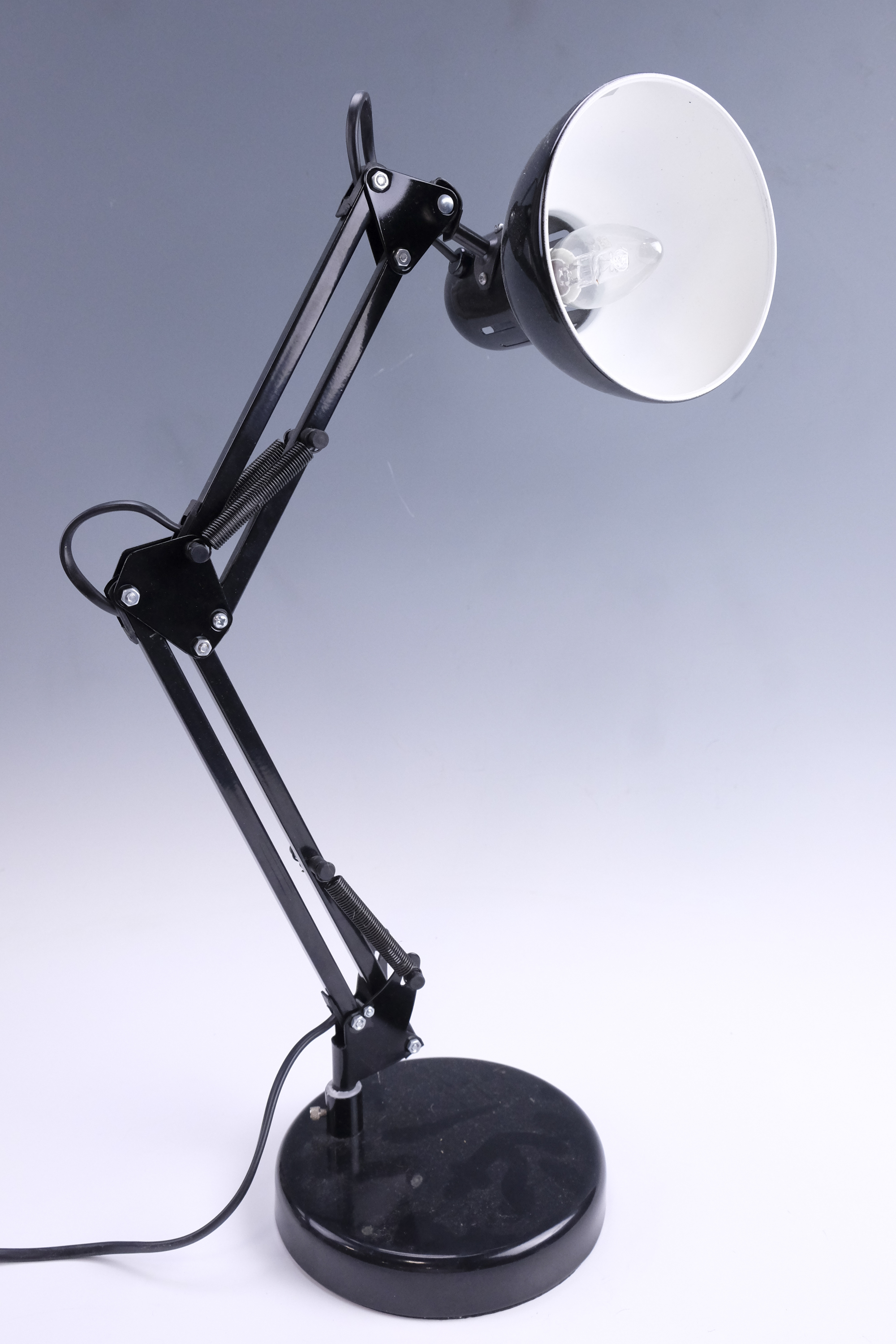 A contemporary adjustable black desk lamp