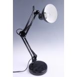 A contemporary adjustable black desk lamp