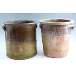 Two earthenware storage crocks, drilled as planters, approximately 30 x 34 cm