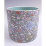 A Chinese famille rose "thousand flowers" porcelain cylindrical vase, 16 x 15 cm