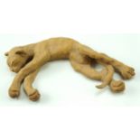 A late 20th Century earthenware sculpture of a sleeping cat, having impressed mark to base, 23 cm