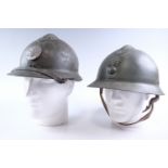 Two French Adrian pattern helmets