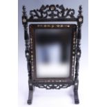 A late 19th / early 20th Century Anglo-Indian swivel dressing / toilet mirror, (a/f), 25.5 x 15 x 45