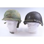 Two US M1 type helmets