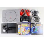Sony PlayStation and PS2 games consoles together with two Sonic The Hedgehog games, and five