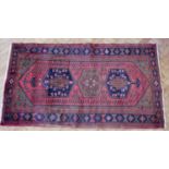 A Persian Hamadan hand-knotted wool-pile rug, 200 x 108 cm