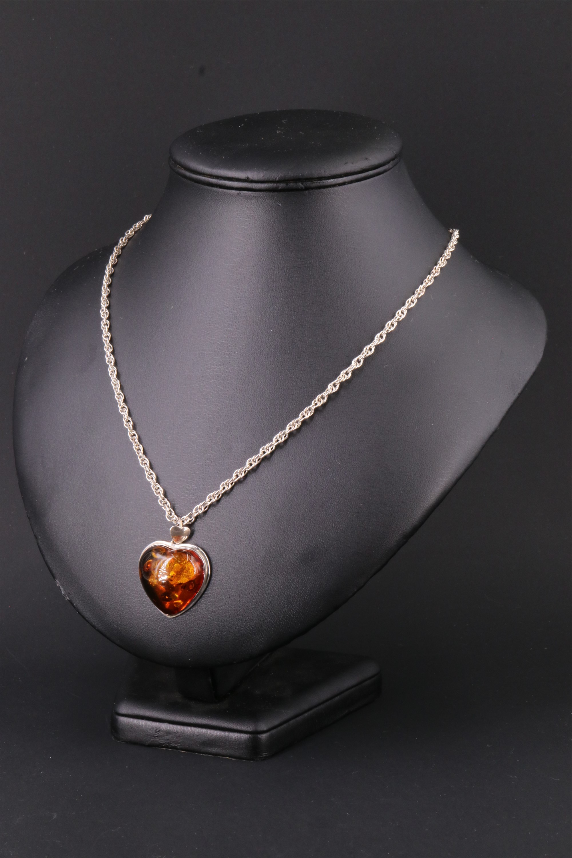 A contemporary sun spangled amber pendant necklace, being a 25 x 25 mm heart shaped amber cabochon - Image 2 of 8