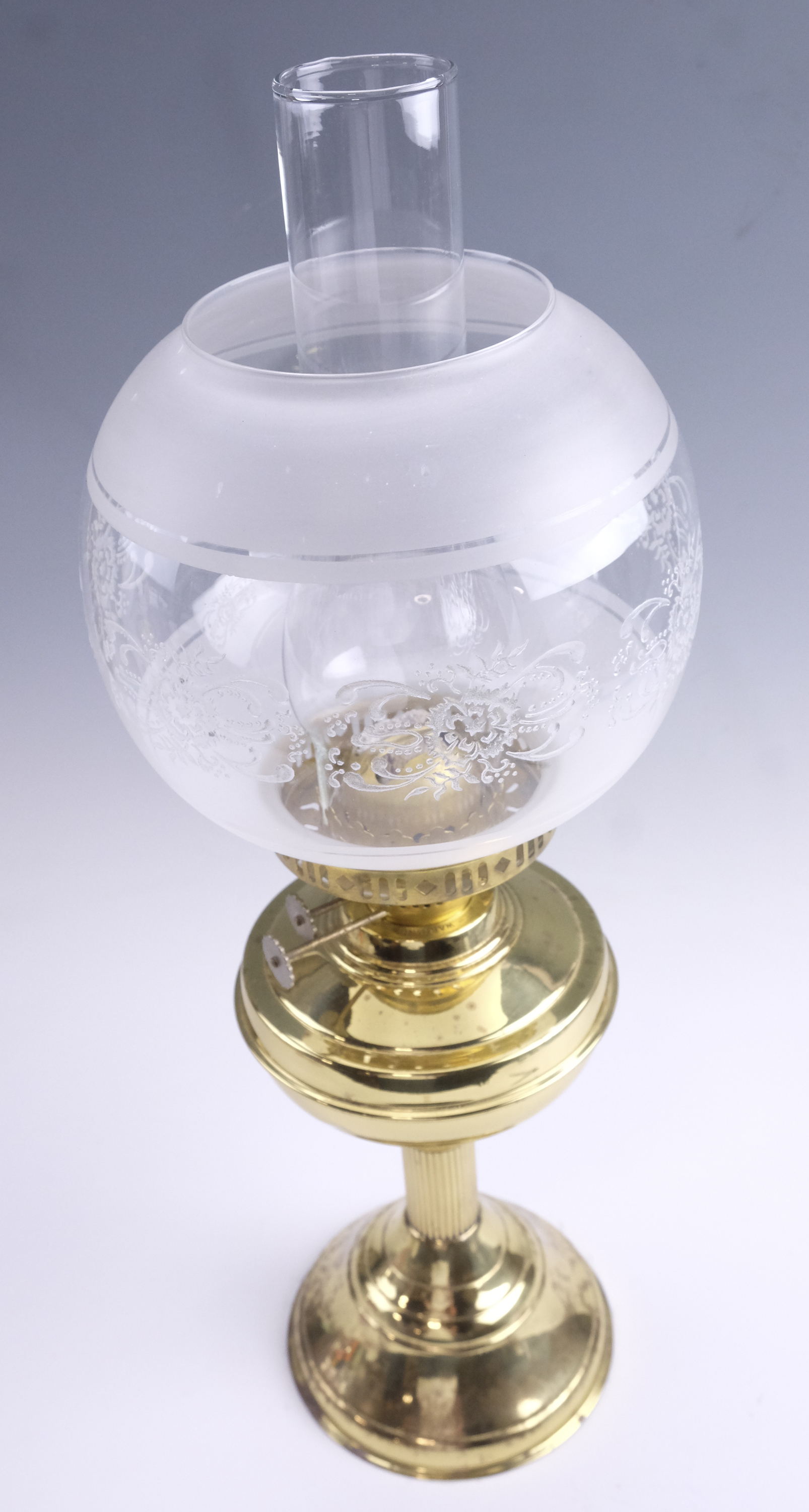 A late 20th Century brass twin wick oil lamp, having a frosted and floral decorated glass globe, - Image 2 of 3