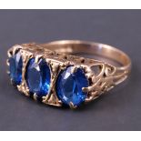 A three-stone vivid blue spinel ring, comprising three large oval-cut stones each of approx .75