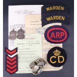 A small group of Second World War Home Front Civil Defence insignia together with an ARP Appointment
