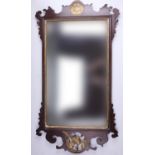 An old reproduction Chippendale style mahogany and parcel gilt fretwork mirror, having a ho-ho