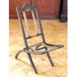 A Victorian ebonised beech folding chair, in need of re-caning, 74 cm high