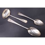 A George III silver old English pattern dessert spoon and teaspoon, together with a George V