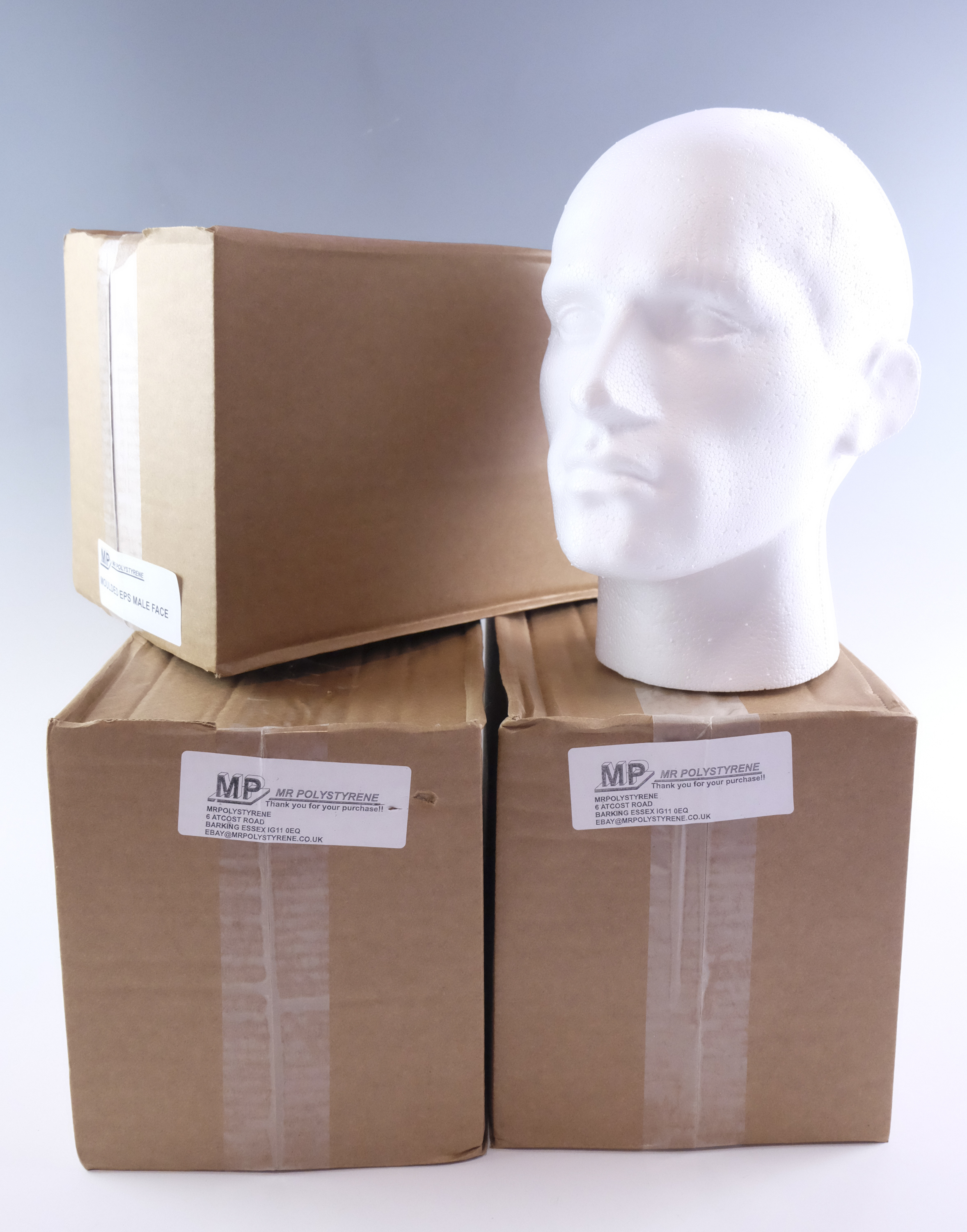 Three new-old-stock polystyrene display mannequin heads, boxed