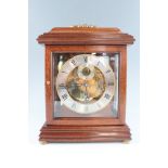 A late 20th Century mahogany bracket clock, the Hermle movement striking and chiming on four bells