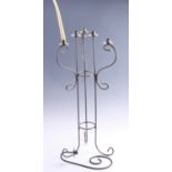 A contemporary wrought iron six candle torchère, together with a conforming single candle wall