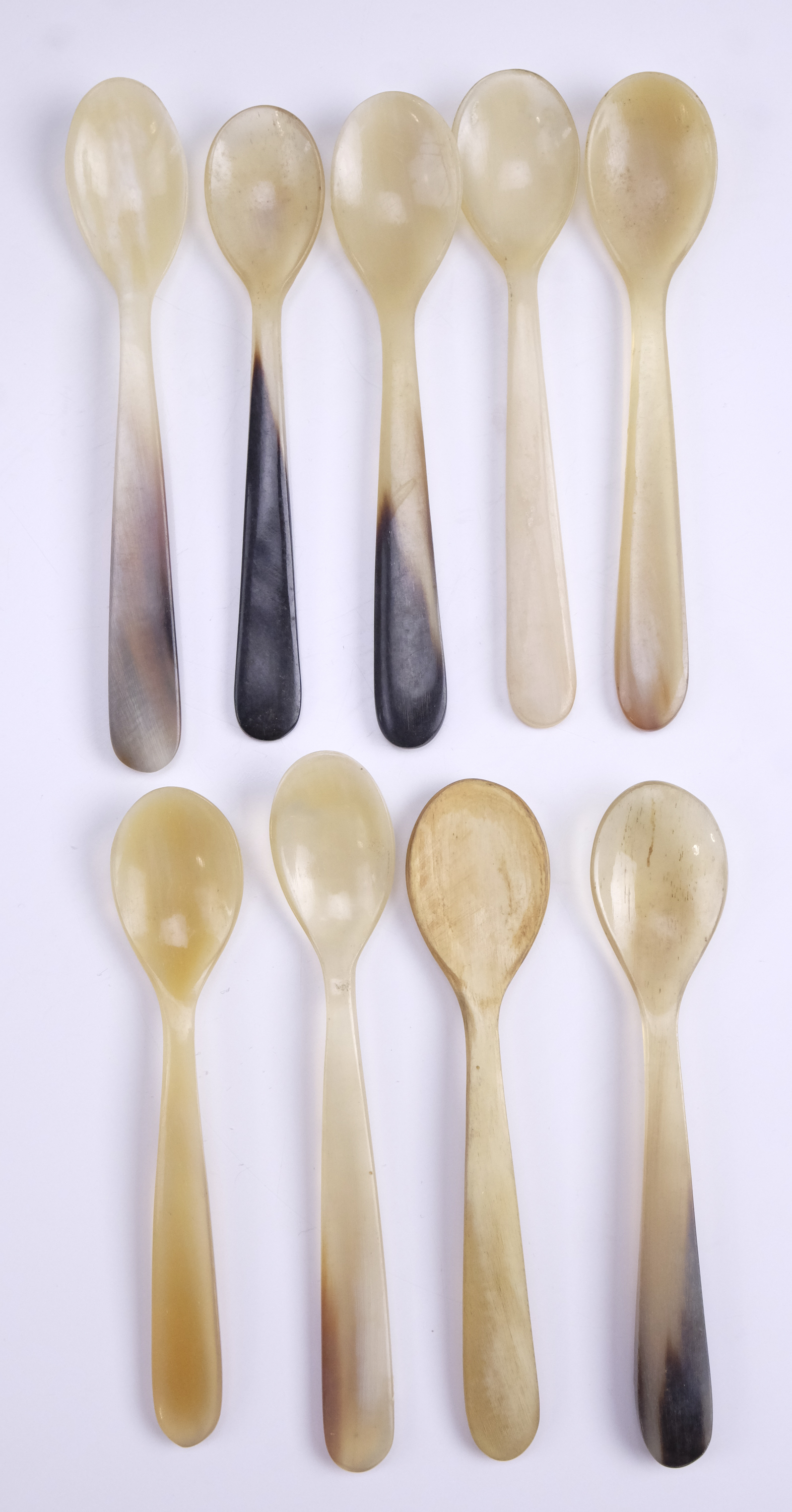 Nine 19th Century horn spoons, longest 13 cm