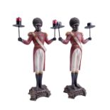 A pair of composition candelabra in the form of stylized 19th Century soldiers, 41 cm