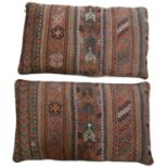 A pair of late 20th Century woven and embroidered North African cushions, down filled, 94 x 54 cm
