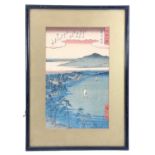 A Japanese rice paper painting of a coastal settlement with mountains beyond, in gilt card mount and