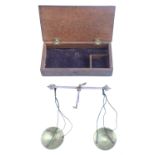 A 19th Century cased set of pocket beam scales, the wooden case bearing an old Sotheby's Belgravia