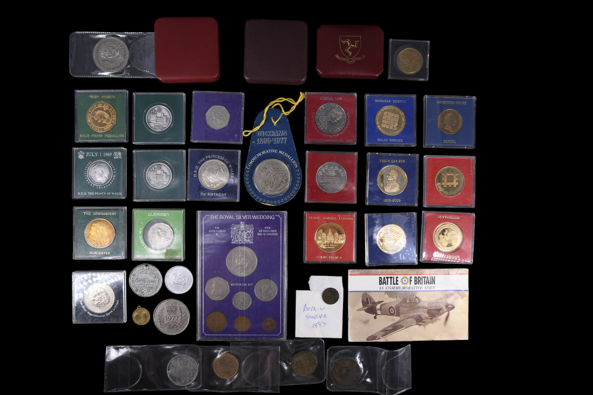 A quantity of royal commemorative coins, tokens, and medallions together with a group of other