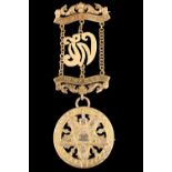 A 9 ct yellow metal Masonic medal for the 'Order of the Eastern Star', brooched lower medallion