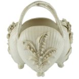 A late 19th Century white porcelain basket, modelled as four shells each decorated with applied