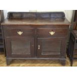 An early 19th Century oak dresser base of two drawers over a cupboard, 115 x 52 x 93 cm