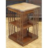 An Edwardian mahogany bookstand, having a hinged lid enclosing a shallow compartment, (a/f), 48 x 48