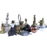 A quantity of oil lamp parts, including cast iron bases, cut glass and brass fonts, etc