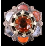 A Victorian Scottish polished hardstone "pebble" brooch of flowerhead boss form, 27 mm