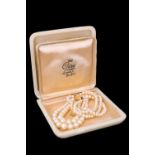 A vintage double string of adorsed graduated faux pearls by Ciro, having a 9 ct yellow metal box