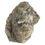 A sandstone statuary fragment of a putto's head, approximately 21 x 20 x 17 cm