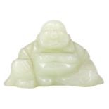 A carved jade figure of a seated Buddha, 4 cm high