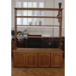A late 20th Century pitch-pine low dresser, comprising a plate rack over a cupboard base, 172 x 43 x
