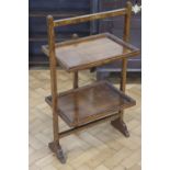 A 1930s carved oak folding dumb-waiter, 51 x 36 x 88 cm