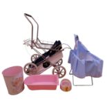 A group of vintage doll's accessories, including a folding pram, a cot, a Babywunder Disney Minnie