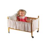 A large Toyse composition doll together with a wooden cot, latter 60 x 36 x 40 cm