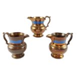 Three Victorian copper lusterware jugs, 14 cm, (a/f)