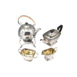 A 1920s -1930s electroplate spirit kettle and stand together with a three-piece tea set
