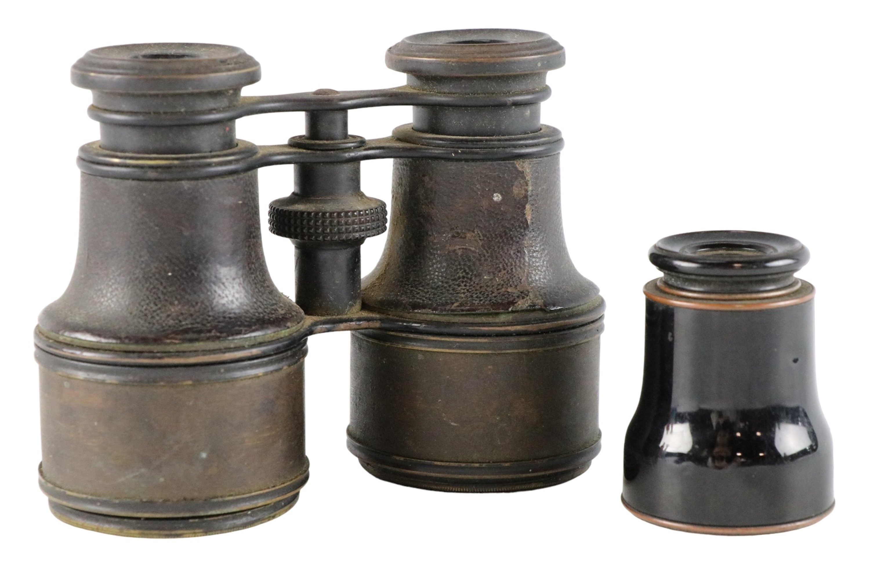 An early 20th Century three draw pocket telescope and a pair of leather covered field glasses,